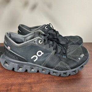 On Running Black Athletic Shoes with Breathable Mesh and Cushioned Sole